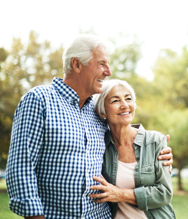 smiling senior couple on walk